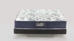 Modern hybrid mattress with quilted top, navy sides, and black foundation for comfort and style.