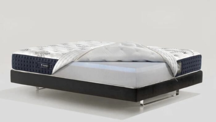 Modern luxury mattress with memory foam on a sleek black frame for optimal comfort.