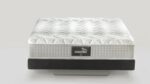 Luxury modern mattress with quilted texture, firm support base, and prominent brand label for comfort.