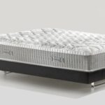 Luxurious modern mattress with plush quilting on a sleek, contrasting platform base.