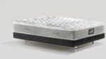 Luxurious modern mattress with plush quilting on a sleek, contrasting platform base.