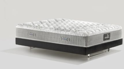 Luxurious modern mattress with plush quilting on a sleek, contrasting platform base.
