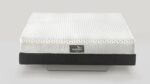 Modern square mattress with textured top, light gray and black design, luxury brand label.
