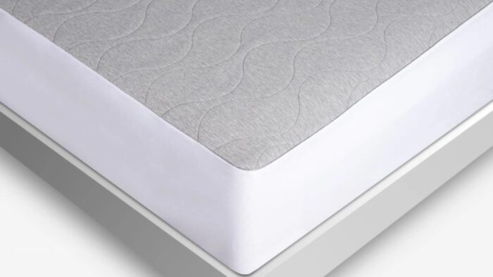 Gray quilted mattress with a modern white border, highlighting comfort and contemporary design.