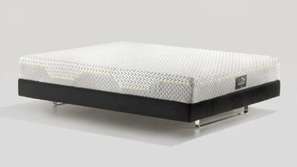 Modern mattress with geometric pattern and black base, elevated on metal legs.