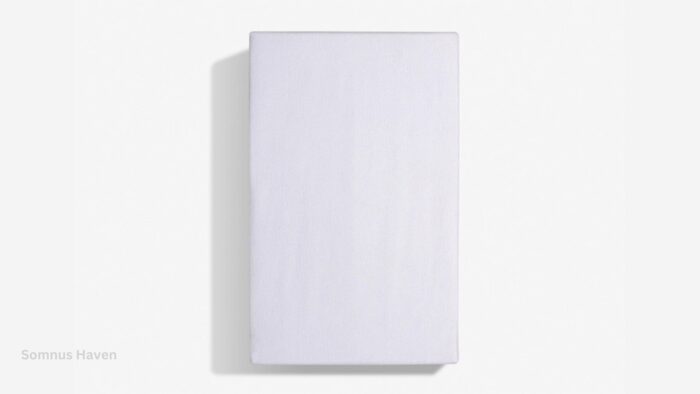 Minimalist white panel with glossy finish and soft lighting for serene design.
