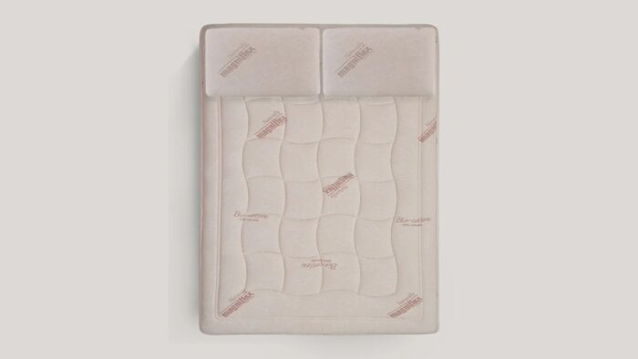 Luxurious beige quilted mattress with branding and dual-section design for enhanced comfort.
