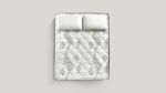 Elegant quilted mattress with plush pillows, showcasing craftsmanship and luxurious comfort.