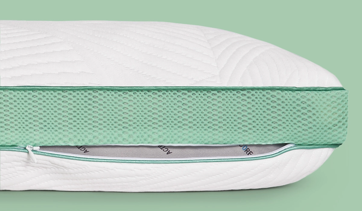 Plush quilted mattress with breathable green mesh and removable cover for comfort and style.