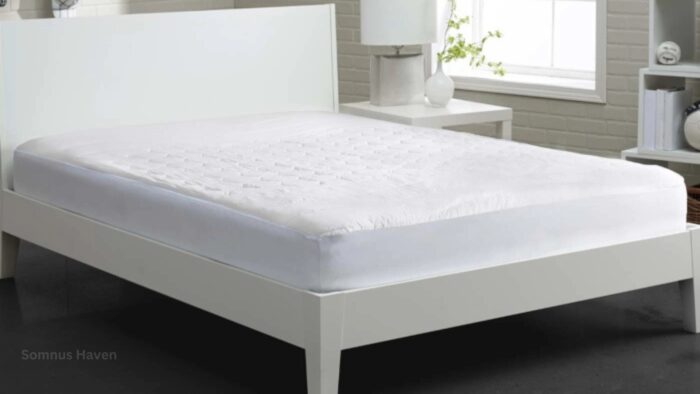 Modern white bedroom with sleek bed, soft mattress cover, and ambient lighting.