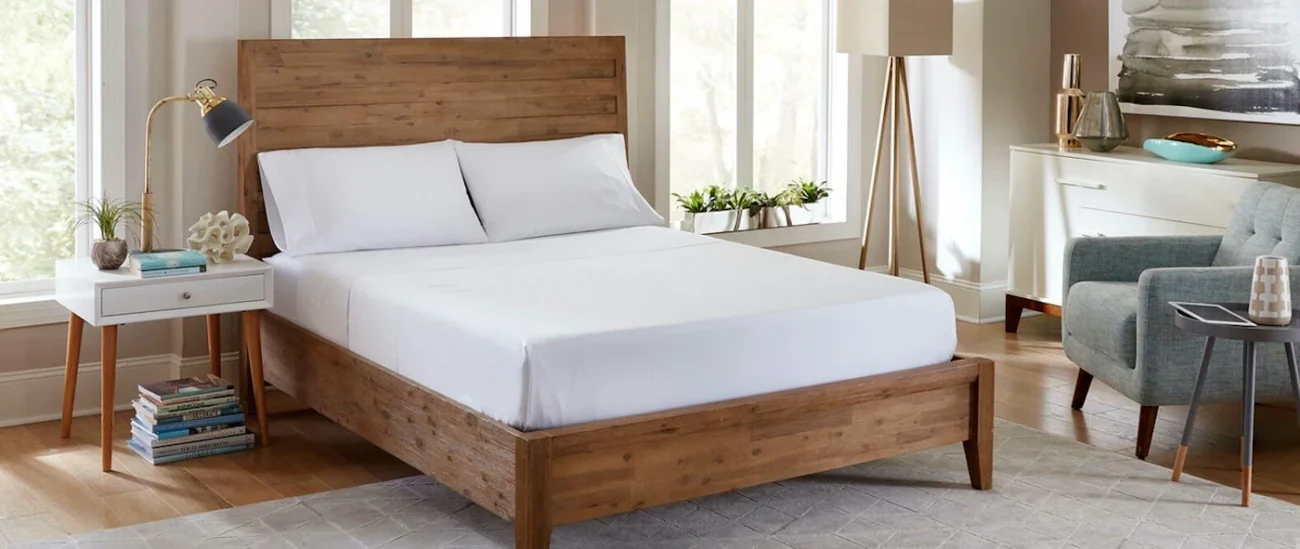 Modern bedroom with wooden bed, natural light, neutral colors, minimalist decor, cozy ambiance.