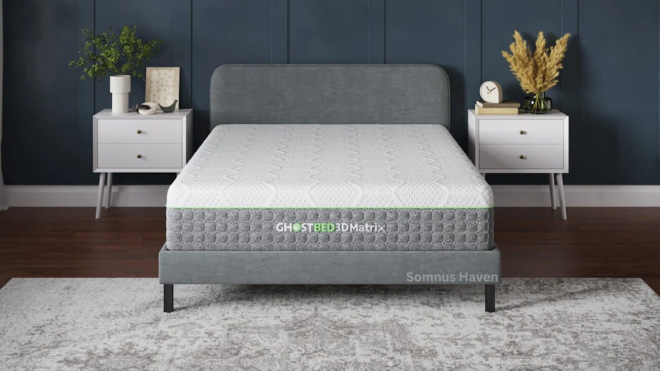Modern bedroom with gray bed, teal wall, white nightstands, plants, and patterned rug.
