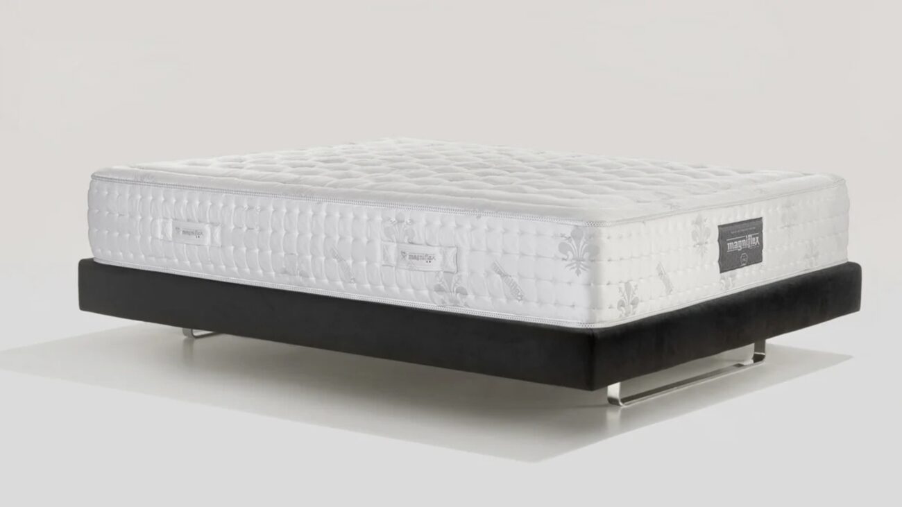 Plush modern mattress on minimalist bed frame for ultimate comfort and style.