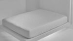 Minimalist white mattress highlighting modern design and quilted comfort for serene sleep.