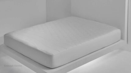 Minimalist white mattress highlighting modern design and quilted comfort for serene sleep.