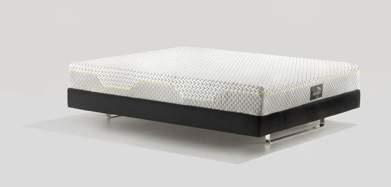 Modern mattress with textured fabric and black base for stylish, comfortable sleep.