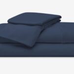 Navy blue luxury bed linens set for a relaxing and sophisticated sleep experience.