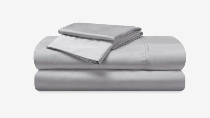 Luxurious gray bedding set featuring high-thread-count sheets for elegant, minimalist bedroom decor.