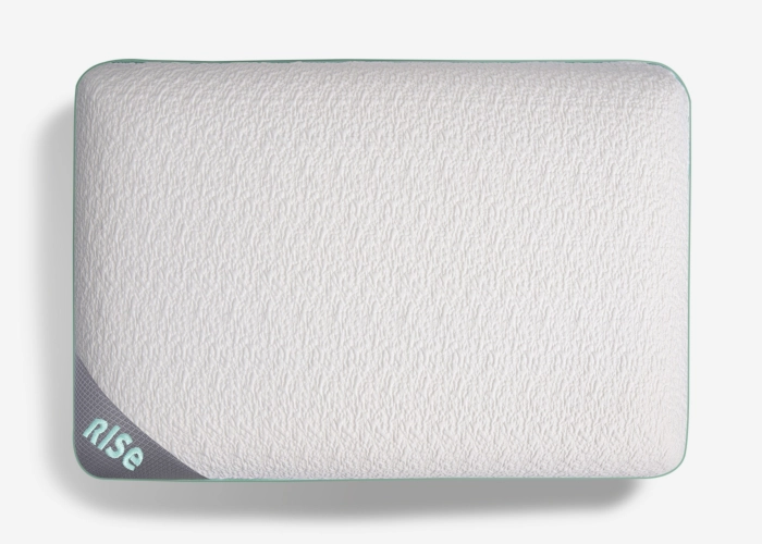 Modern ergonomic pillow with breathable cover, textured surface, and nise brand tag.
