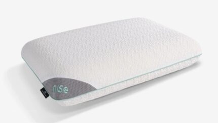 Ergonomic Rise pillow in soft white with gray panel, enhances sleep comfort and support.