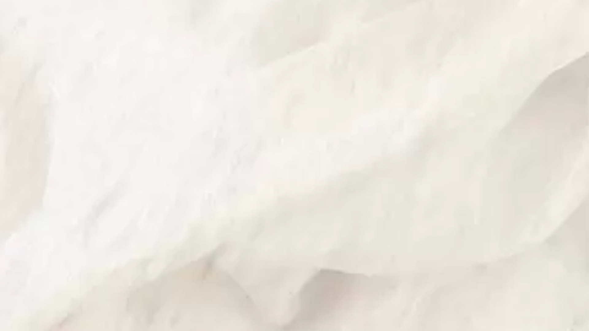 Delicate white fabric texture evokes serenity, elegance, and calm through light and shadow.