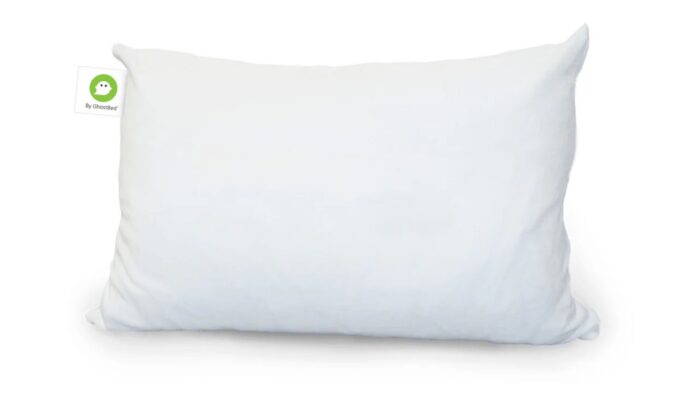 White rectangular pillow with green eco-friendly tag, offering modern design and comfort.