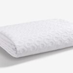 White textured blanket for decor, offering elegance and warmth in any room.