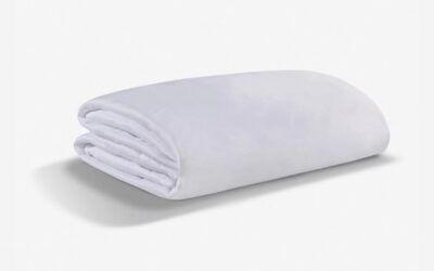 Soft white blanket with minimalist design, offering warmth and comfort for any decor.