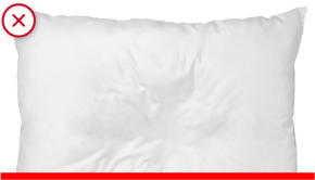 White rectangular pillow on black background, soft fabric, minimal design, ideal for bedding.