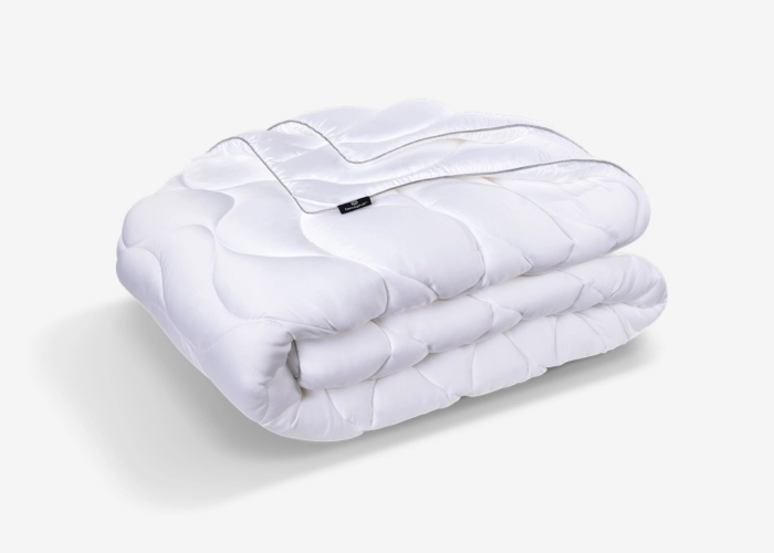 White duvet with soft finish, gentle patterns, and durable stitching for minimalist elegance.