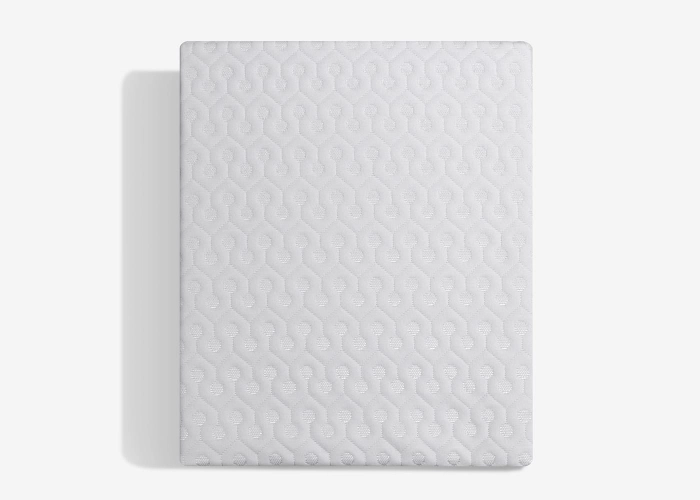Minimalist white mattress with subtle pattern, ideal for modern and versatile decor.