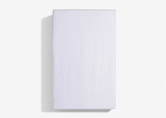 Minimalist white notebook on surface, sleek design, soft lighting, serene modern aesthetic.