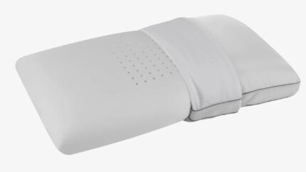 Ergonomic white pillow with dual heights, perforations for airflow, and soft fabric cover.