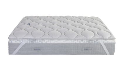 Modern mattress with quilted heart pattern, gray sides, and handles for easy positioning.
