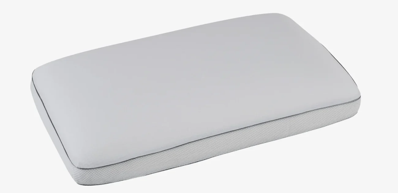 Minimalist rectangular pillow in light gray, elegant trim, breathable fabric, for stylish comfort.