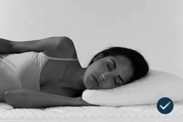 Peaceful woman sleeping in minimalist black-and-white scene, exuding tranquility and serene elegance.